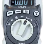 Megger digital multimeter with rotary dial and three function buttons; display shows 0.007 V, test ports at bottom