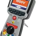 Handheld insulation tester (Megger) displaying 1000V with a multi-coloured function dial and red Test button.