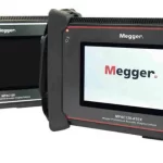 Two Megger electrical testing devices with screens in protective housings, used for insulation resistance testing.